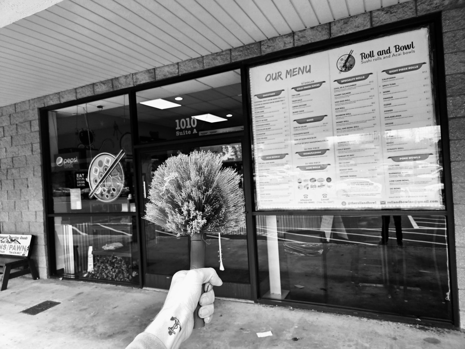 Window-care tools in front of restaurant storefront glass