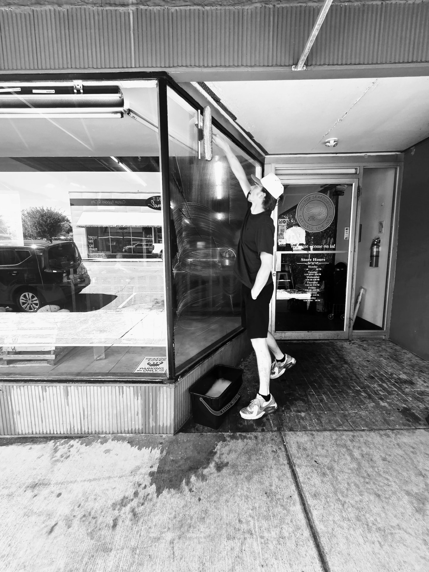 Vista cleaning storefront windows in Albemarle, NC